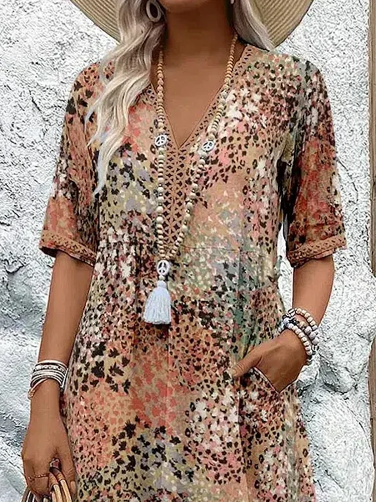 Damen Kleid mit V-Ausschnitt | Knie­länge und Musterdesign