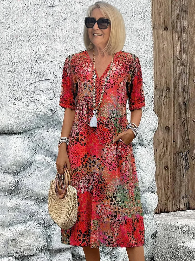 Damen Kleid mit V-Ausschnitt | Knie­länge und Musterdesign