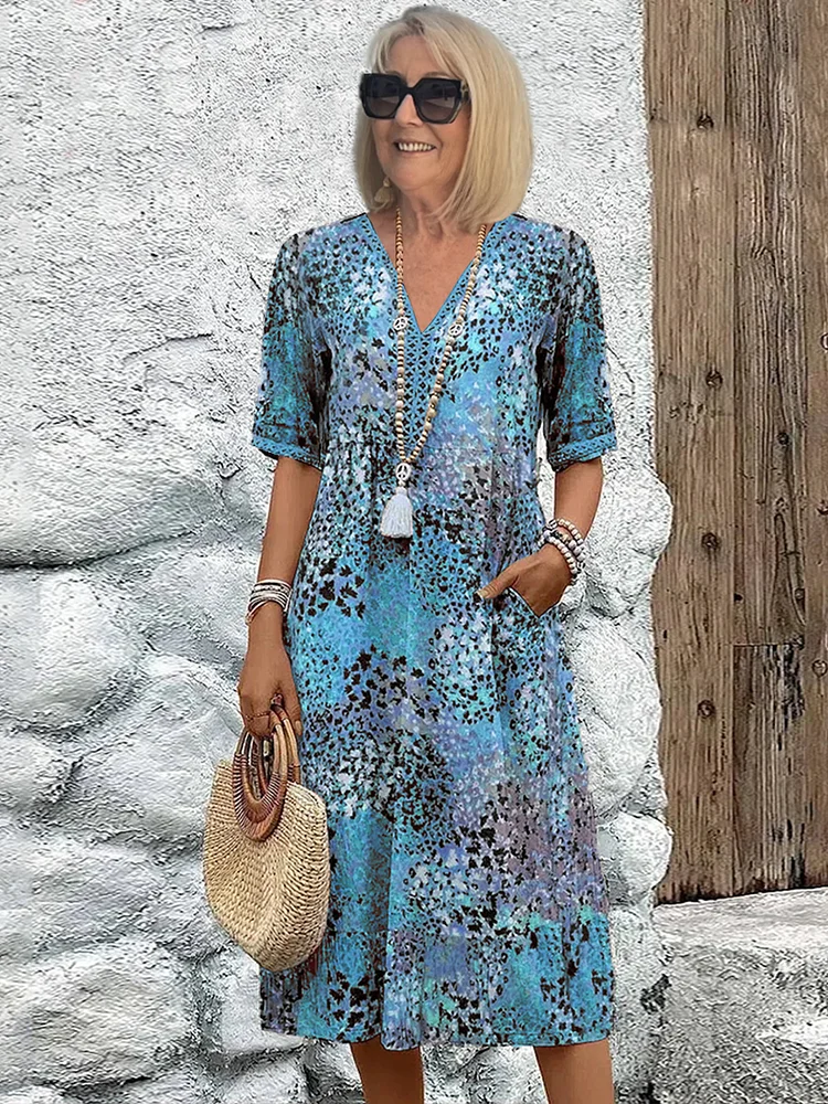 Damen Kleid mit V-Ausschnitt | Knie­länge und Musterdesign