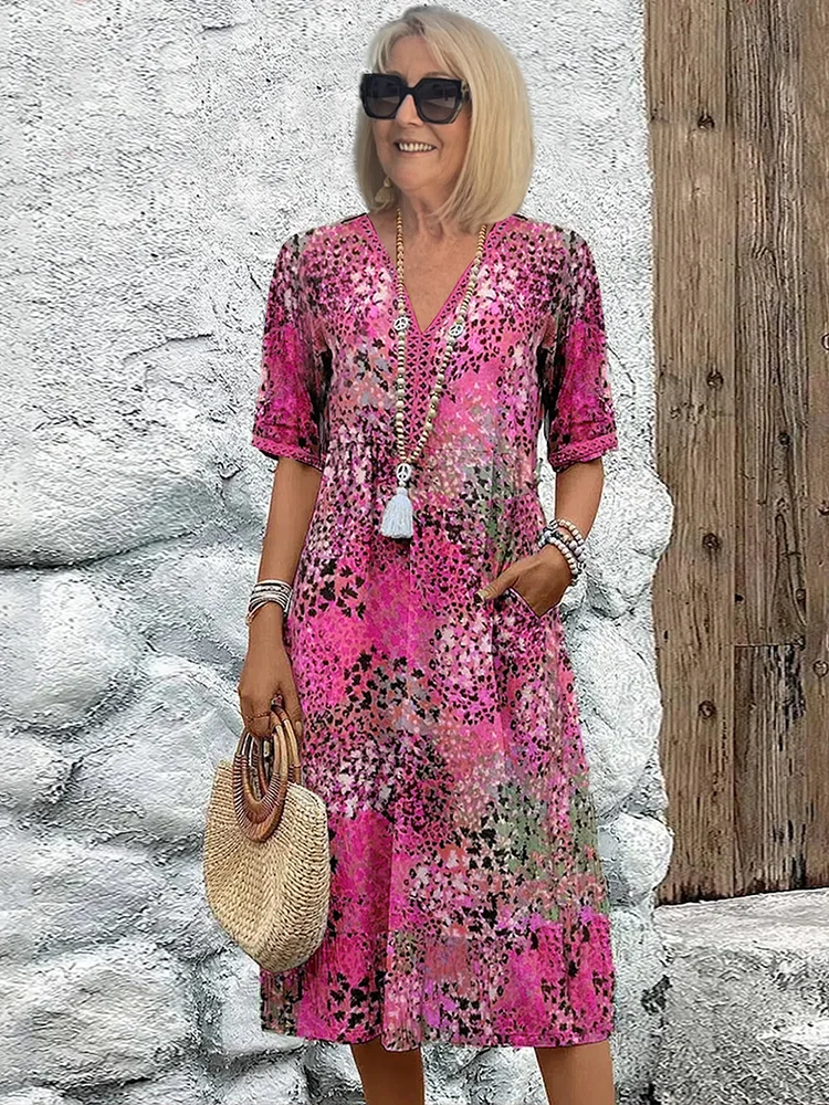 Damen Kleid mit V-Ausschnitt | Knie­länge und Musterdesign